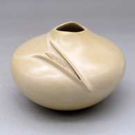 A buff bowl with an organic opening and a carved ear-of-corn applique
 by Iris Nampeyo of Hopi