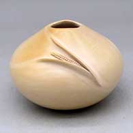 A buff jar with an organic opening and a carved ear of corn applique
 by Iris Nampeyo of Hopi