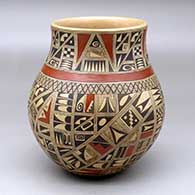 A polychrome water jar decorated with a medium sherd geometric design
 by Rondina Huma of Hopi