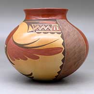 A polychrome jar with a short recurved neck and decorated with a parrot and geometric design, click or tap to see a larger version