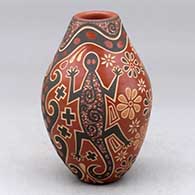 A small polychrome vase decorated with a sgraffito and painted three panel lizard and geometric design
 by Glendora Fragua of Jemez