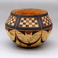 A polychrome mixed clay bowl decorated around the body with a six-panel checkerboard and geometric design
 by Calvin Analla Jr of Laguna