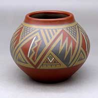 A polychrome jar decorated with a four-panel geometric design around the body
 by Lela and Luther Gutierrez of Santa Clara