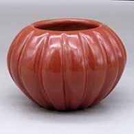 Click for a larger view A red melon bowl carved with 16 ribs
 by Angela Baca of Santa Clara