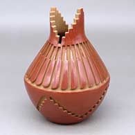 Click for a larger view A red prayer jar carved with a kiva step design below the shoulder and a feather design above the shoulder
by Anna Archuleta of Santa Clara