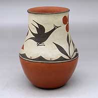 A polychrome vase decorated above the shoulder with a two panel roadrunner, flower, plant and geometric design, from Fred Harvey days
 by Harviana Toribio of Zia