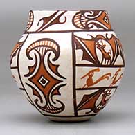 A small polychrome jar decorated with a four-panel deer-in-his-house, rainbird and geometric design,., click or tap to see a larger version