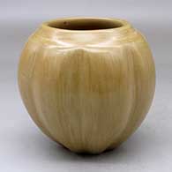 A buff melon jar with eight repousse ribs
 by Toni Roller of Santa Clara