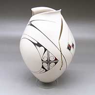 A polychrome jar with an organic cut opening and decorated with a flowing two  panel geometric design
 by Diego Valles of Mata Ortiz and Casas Grandes