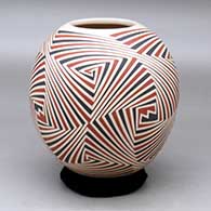 A polychrome jar decorated with a four panel geometric design
 by Rodrigo Perez of Mata Ortiz and Casas Grandes