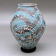 A polychrome jar with a flared rim and decorated with a slipped and sgraffito four panel serpent, turtle and geometric design
 by Martin Olivas of Mata Ortiz and Casas Grandes