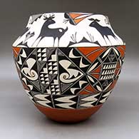 A large polychrome jar decorated with a three panel geometric design below the shoulder and a six panel deer and geometric design above the shoulder, click or tap to see a larger version