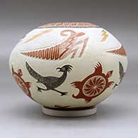 A polychrome jar decorated with a lightly carved, sgraffito and painted turtle, roadrunner, grasshopper, lightning bolt and geometric design, click or tap to see a larger version