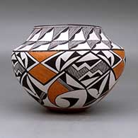 A polychrome jar decorated with a four panel fine line and geometric design below the shoulder and a geometric design above, click or tap to see a larger version
