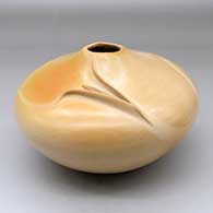 A buff seed jar with an organic opening, an ear of corn applique and her matte Breath of Life design
 by Iris Nampeyo of Hopi