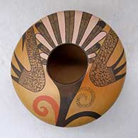 A high shouldered polychrome jar decorated with a bird element, feather and geometric design, click or tap to see a larger version