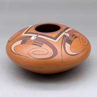 A polychrome bowl decorated above the shoulder with a four panel bird element and geometric design
 by Jacob Koopee of Hopi