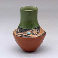 Click for a larger view A small polychrome vase with a sgraffito and micaceous clay avanyu design above the shoulder with an inlaid turquoise
by Russell Sanchez of San Ildefonso