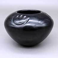 Polished black jar with a three-panel lightly carved bear-paw design
 by Greg Garcia of Santa Clara