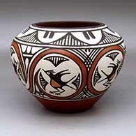 Click for a larger view A polychrome high-shoulder jar decorated with a six-panel roadrunner, rainbow and geometric design
by Ruby Panana of Zia