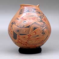 A polychrome jar with a geometric cut opening and decorated with a two panel lizard and geometric design, click or tap to see a larger version