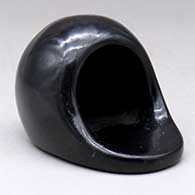 A plain polished black horno
 by Maria Martinez of San Ildefonso