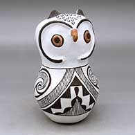 A polychrome owl figure decorated with a fineline, spiral and geometric design
 by Frances Torivio of Acoma