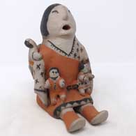 Grandmother storyteller with 3 children
 by Josephine Arquero of Cochiti