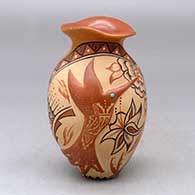 A polychrome jar with an organic rim, bird applique and a flower, bird element and geometric design
 by Helen Tafoya of Jemez