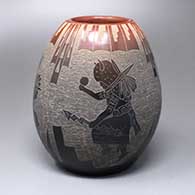 A black jar with a sienna rim and a sgraffito four-panel buffalo dancer and geometric design
 by Dan Tafoya of Santa Clara