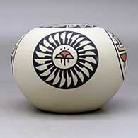 A polychrome jar decorated with a four-panel ring-of-feathers, rain cloud and geometric design, click or tap to see a larger version