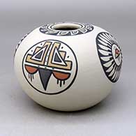 A polychrome jar decorated with a four-panel ring-of-feathers, rain cloud and geometric design
 by Minnie Vigil of Santa Clara