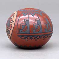 A polychrome seed pot decorated with a medallion of rain clouds and a kiva step, rain cloud and geometric design, click or tap to see a larger version