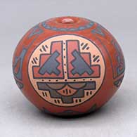 A polychrome seed pot decorated with a medallion of rain clouds and a kiva step, rain cloud and geometric design
 by Minnie Vigil of Santa Clara