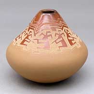 A buff and red low shouldered jar with an organic opening and decorated with a sgraffito kokopelli and geometric design around the neck
 by Jody Naranjo of Santa Clara