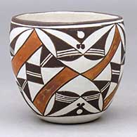 A polychrome jar decorated with a four panel geometric design
 by Carrie Chino Charlie of Acoma