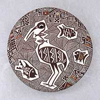 Click for a larger view A polychrome seed pot decorated above the shoulder with a crane, fish, fineline and geometric design
by Rebecca Lucario of Acoma