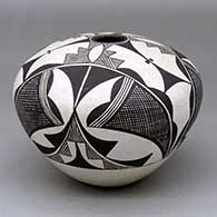 A black on white seed pot decorated with a three panel fineline and geometric design
 by Marie Z Chino of Acoma