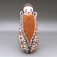 A large polychrome Corn Maiden figure decorated with a geometric design
 by Marie Juanico of Acoma