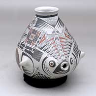 A polychrome fish effigy jar decorated with a geometric design
 by Jose Quezada of Mata Ortiz and Casas Grandes