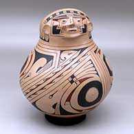 A Ramos polychrome shaman effigy pot decorated with a flowing geometric design
 by Jose Andres Villalba of Mata Ortiz and Casas Grandes