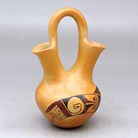 A polychrome wedding vase decorated with fire clouds and a bird element and geometric design
 by Alice Dashee of Hopi