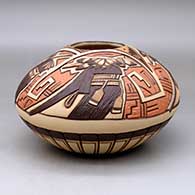 A polychrome jar carved and painted with a long hair and turtle kachina design
 by Elvira Nampeyo of Hopi
