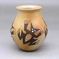A polychrome jar with a rolled lip and decorated with a four panel horned toad and geometric design
 by Agnes Nahsonhoya of Hopi