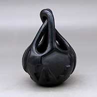 A black engagement basket carved with a two-panel geometric design around the body
 by Flora Naranjo of Santa Clara