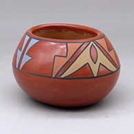 An oval polychrome bowl decorated above the shoulder with a geometric design
 by Flora Naranjo of Santa Clara