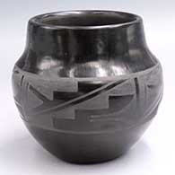 Black-on-black jar with a 4-panel geometric design around the shoulder
 by Carmelita Dunlap of San Ildefonso