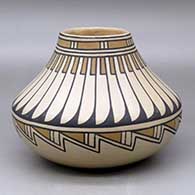 Click for a larger view A polychrome low shouldered jar decorated with a feather and geometric design
by Blue Corn of San Ildefonso
