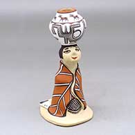 A Zuni Olla Maiden figure with a pot on her head
 by Agnes Peynetsa of Zuni