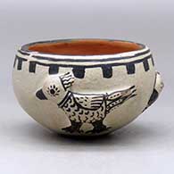 Click for a larger view A polychrome bowl decorated around the body with three bird appliques and a geometric design
by Unknown of Cochiti